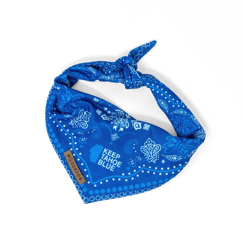 Keep Tahoe Blue Bandana: blue with white patterns, "KEEP TAHOE BLUE" text, quick-dry fabric, WILD BANDANA brown tag.