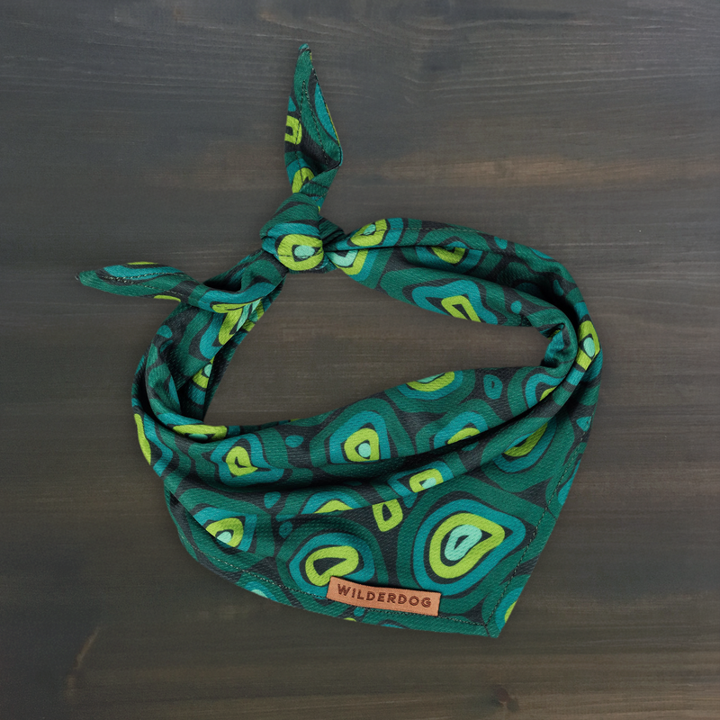 The Treeline Bandana: a green & lime quick-dry accessory with Wilderdog tag—perfect for stylish dog cooling.