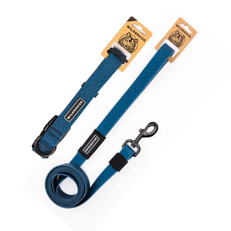 The Pacific Blue Waterproof Leash + Collar Bundle—featuring black hardware, subtle topographic patterns, and brand labels—is displayed flat on a white background.