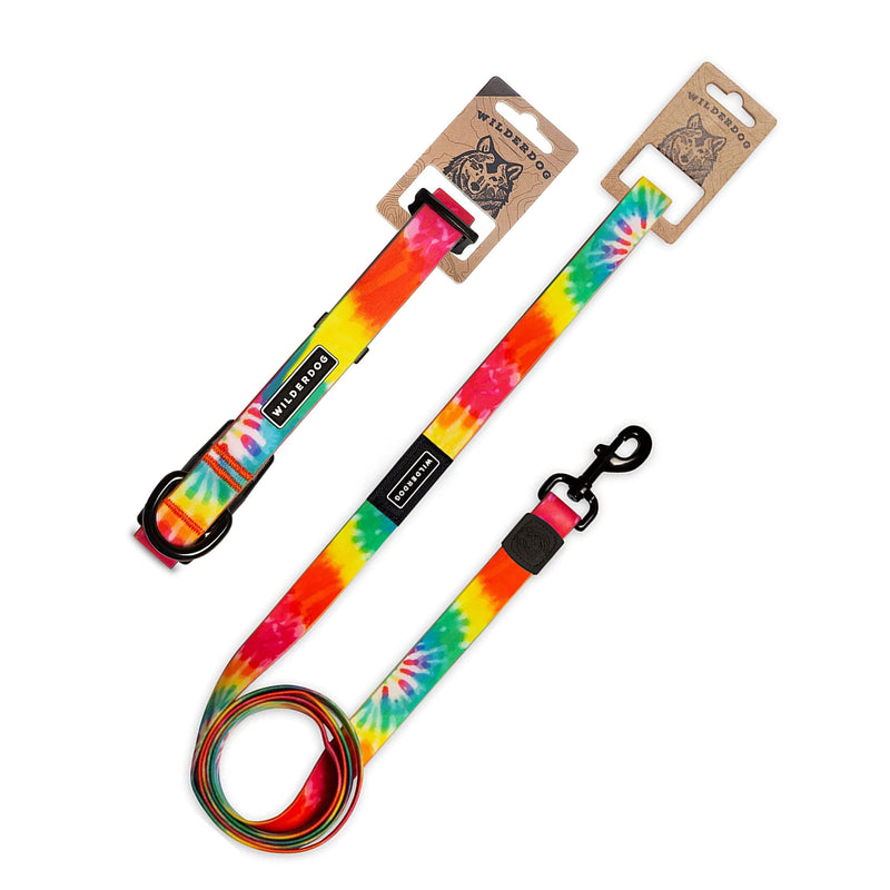 The Tie Dye Waterproof Leash + Collar Bundle features colorful, stink-proof gear with black metal hardware and branded tags, displayed in illustrated cardboard packaging—ideal for those who love durable dog accessories.