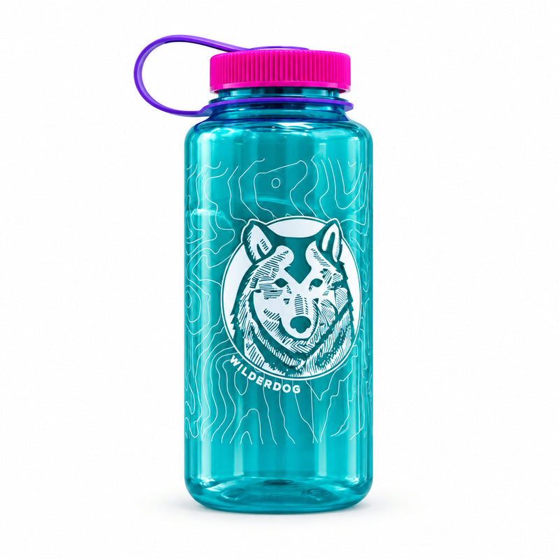 Teal Wilderdog Nalgene™: white wolf, pink lid, purple handle—leak-proof hydration for every adventure.