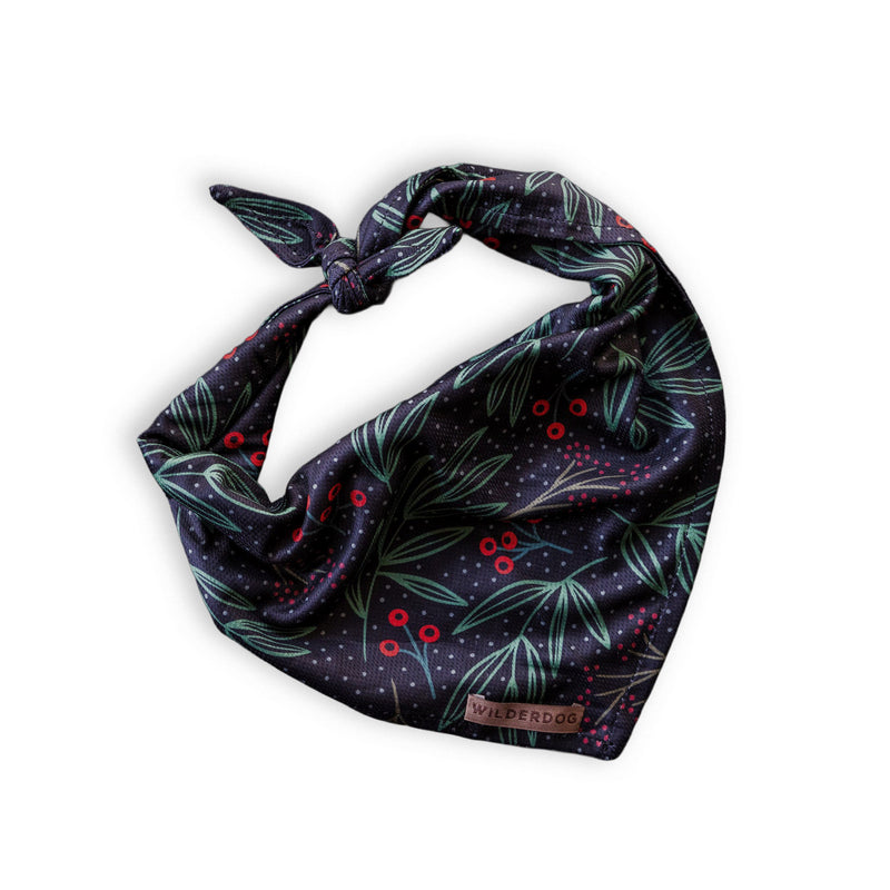 Holly Bandana: Navy dog bandana with green leaves, red berries & Wilderdog label—ideal for hikes with your pup.