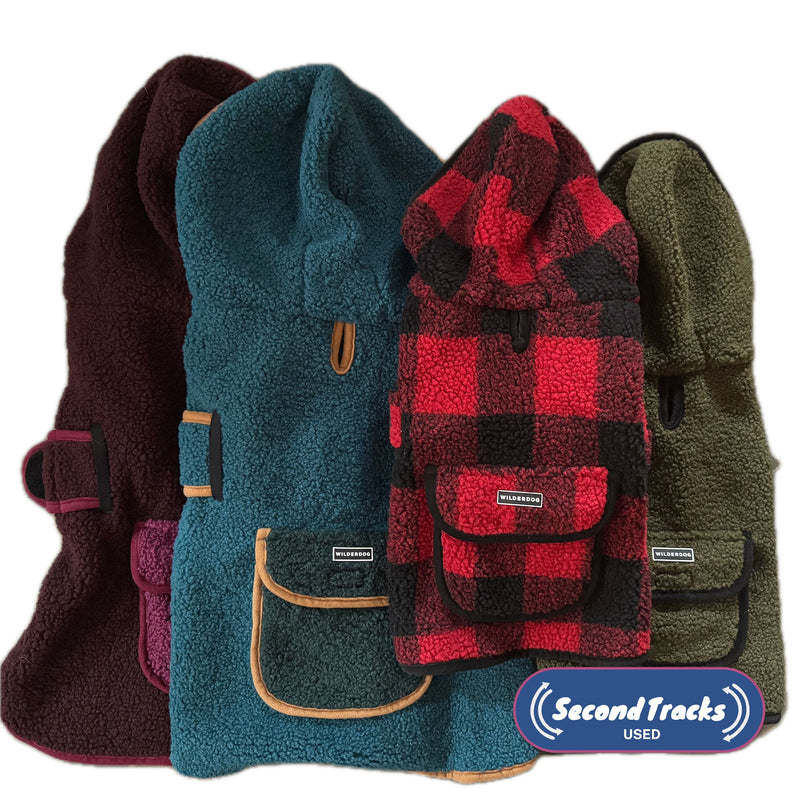 Four vibrant (Used) Sherpa Jackets with hoods, pockets, and a “Second Tracks USED” label at bottom right.