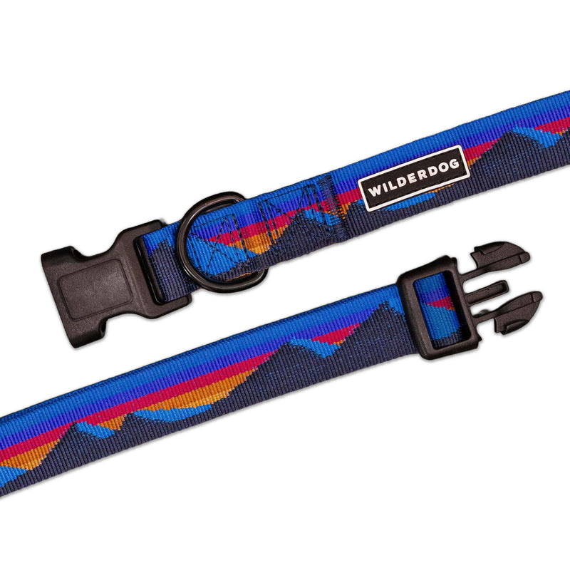 Cordillera Ultralight Collar: blue nylon, mountain pattern, strong buckle, metal ring, “WILDERDOG” label.