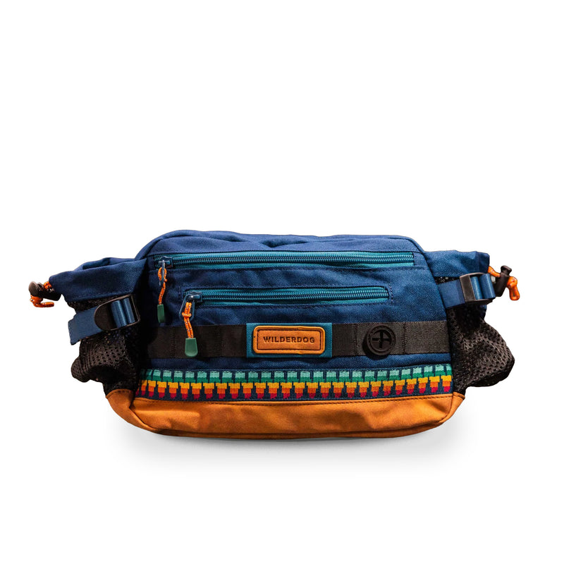 Mega Hip Pack in blue/brown with colorful trim, water-resistant zippers, mesh sides & “Wilderdog” patch.