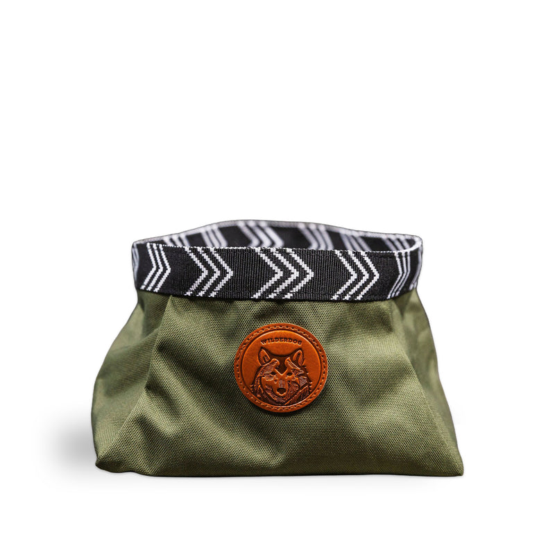 Backpacking Bowl: Green fabric pouch with zigzag trim and dog logo doubles as a portable dog water bowl.