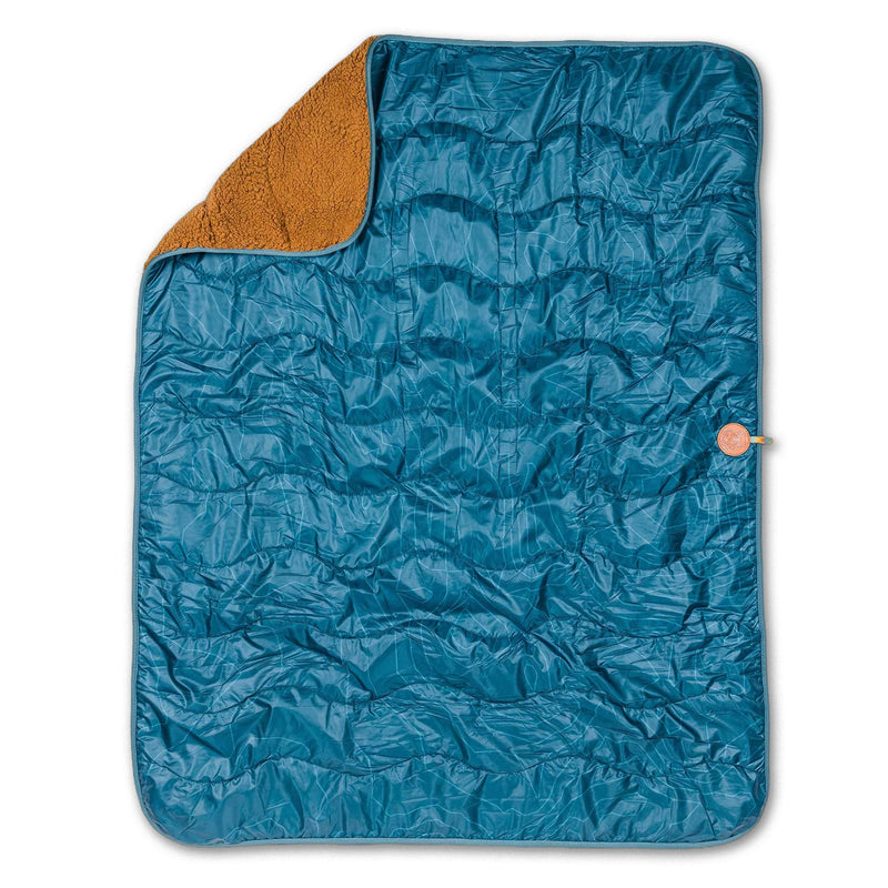 A blue quilted Picnic Blanket with a brown fuzzy corner folded over, showing off both cozy textures.