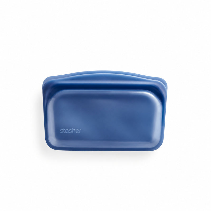 The Stasher™ Snack Bag in blue silicone with a leak-free seal is displayed on a white background.