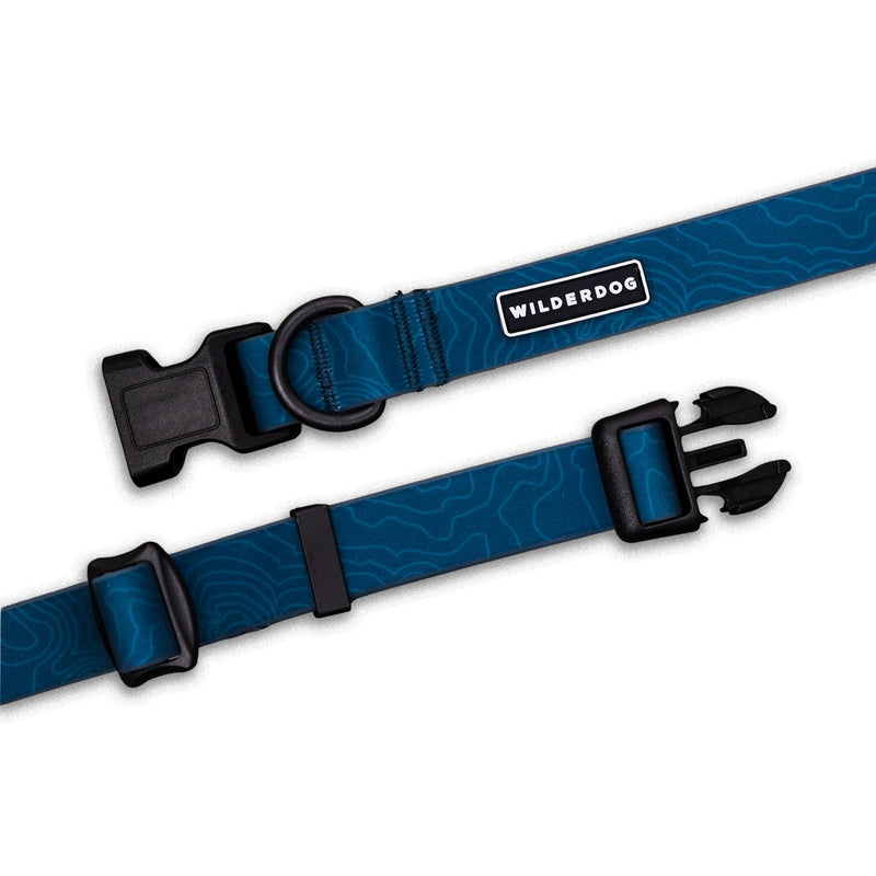 Pacific Blue Waterproof Collar with black buckle, metal D-ring, “Wilderdog” label, shown flat on white background.