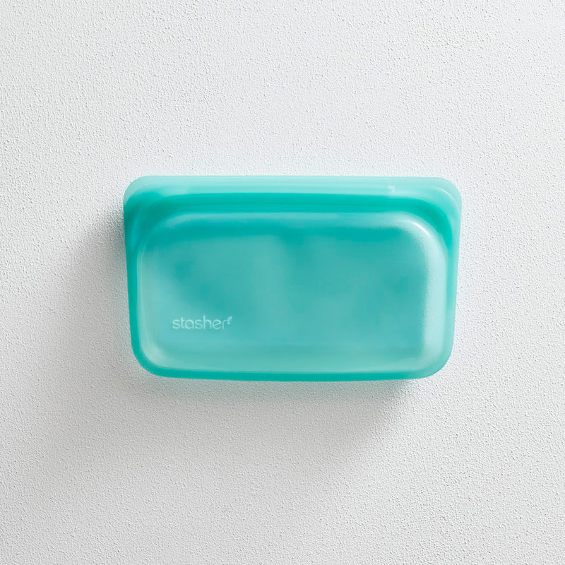 Teal silicone snack bag with a rounded shape and "stasher" logo.